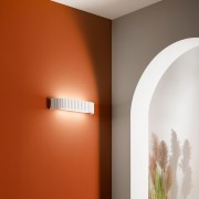Applique LED Nike in metallo ambientato